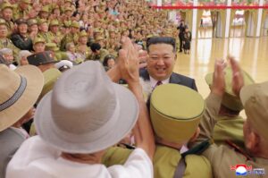 Respected Comrade Kim Jong Un Meets and Has Photo Taken with War Veterans and Persons of Wartime Merits 2 006
